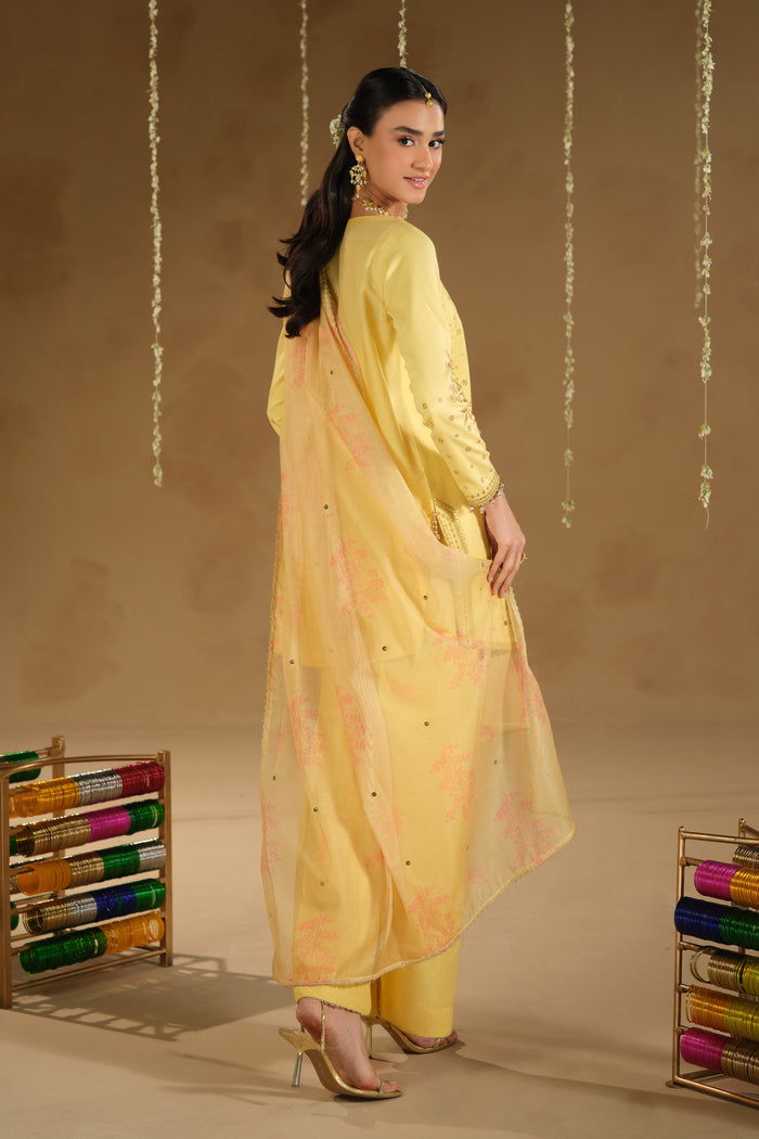 Side walking pose of Aahal Eid outfit highlighting flowing printed dupatta and comfortable culotte trousers