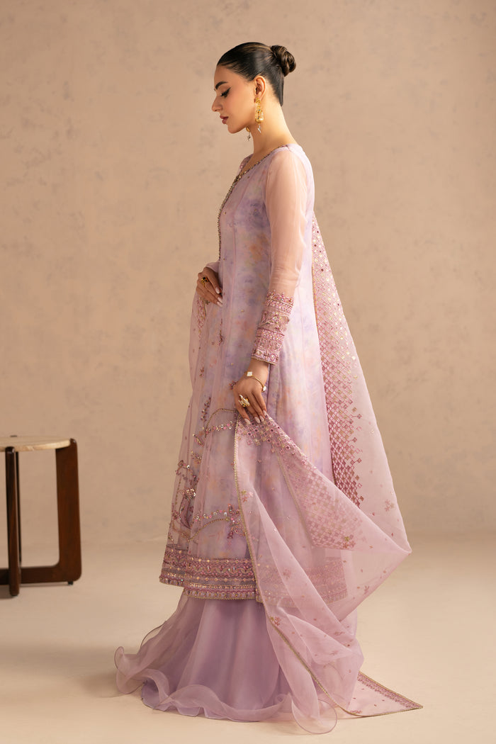 Side walking view showing soft flare of paneled frock and flowing organza dupatta, elegant stitched semi formal eastern dress.