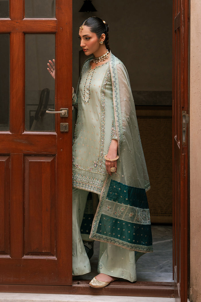 Full length view of Amani aqua organza luxury pret outfit with embroidered shirt and PK raw silk culotte trousers