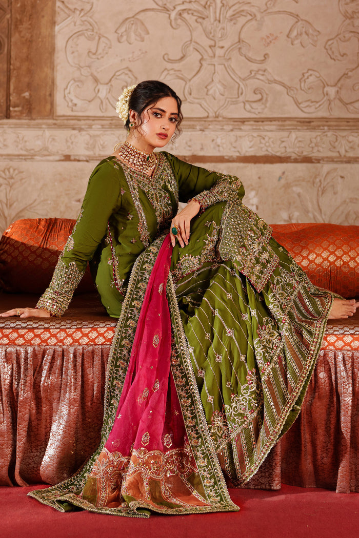 Full front pose of NAQSHI Anadil olive green embroidered formal attire with pink dupatta for wedding and festive celebration looks.
