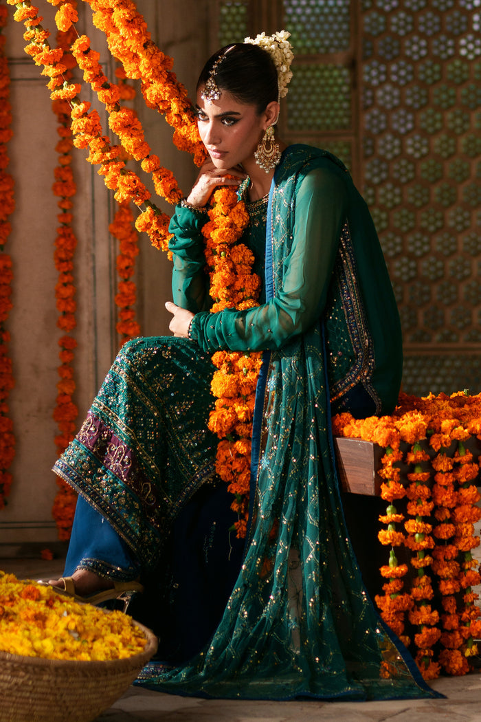 Close-up of Anfa embellished boat neckline with V detail, sequins work and decorative craftsmanship on green crinkle chiffon shirt