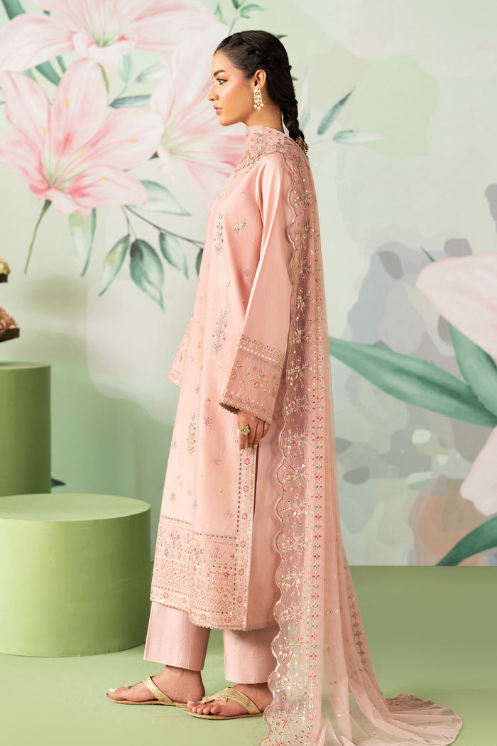Woman in a pink traditional outfit with floral background