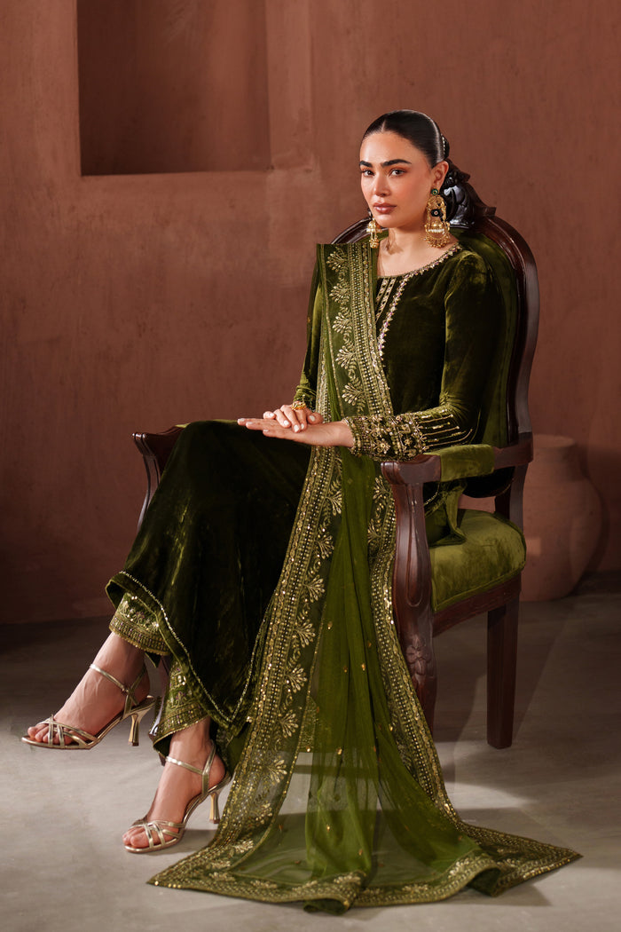 Side pose of NAQSHI dark green ready-to-wear formal outfit styled with matching dupatta for event wear