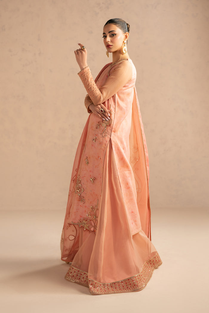 Walking pose view showing movement of organza layers and dupatta drape, elegant ready to wear gathering outfit.