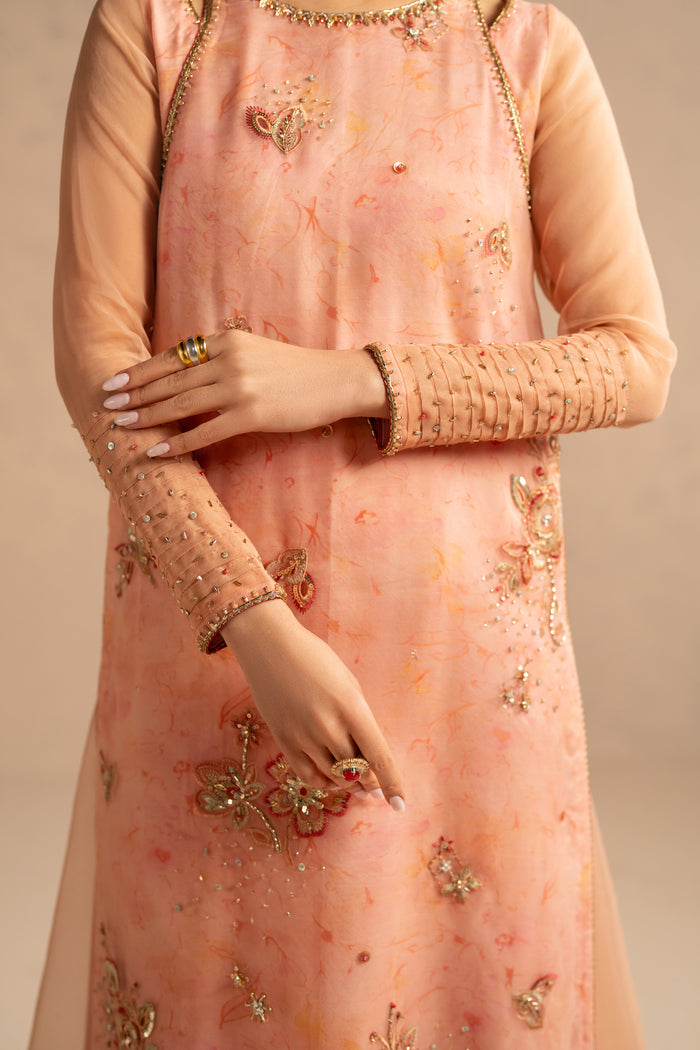 Close up of shirt embroidery and sleeve detailing with light work spray and neat finishing, formal semi formal dress detailing.