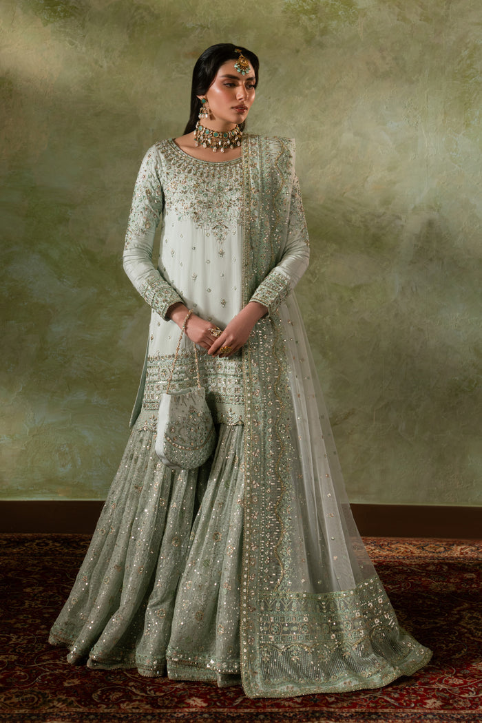 Azeyma pale pistachio Nikkah bridal outfit by NAQSHI, full front view showing raw silk shirt, net sharara, net dupatta and matching pouch, ready to wear 4-piece formal wedding dress.