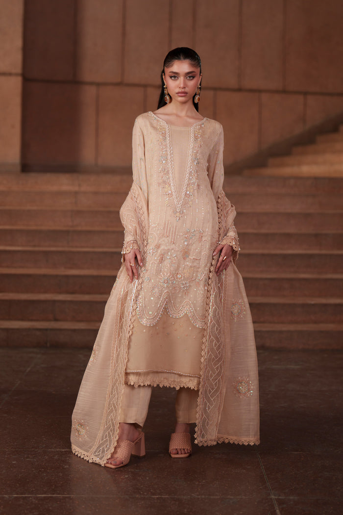 Front styling shot of NAQSHI Beatriz peach 3-piece embroidered outfit featuring detailed borders, layered khadi net shirt and luxury pret elegance