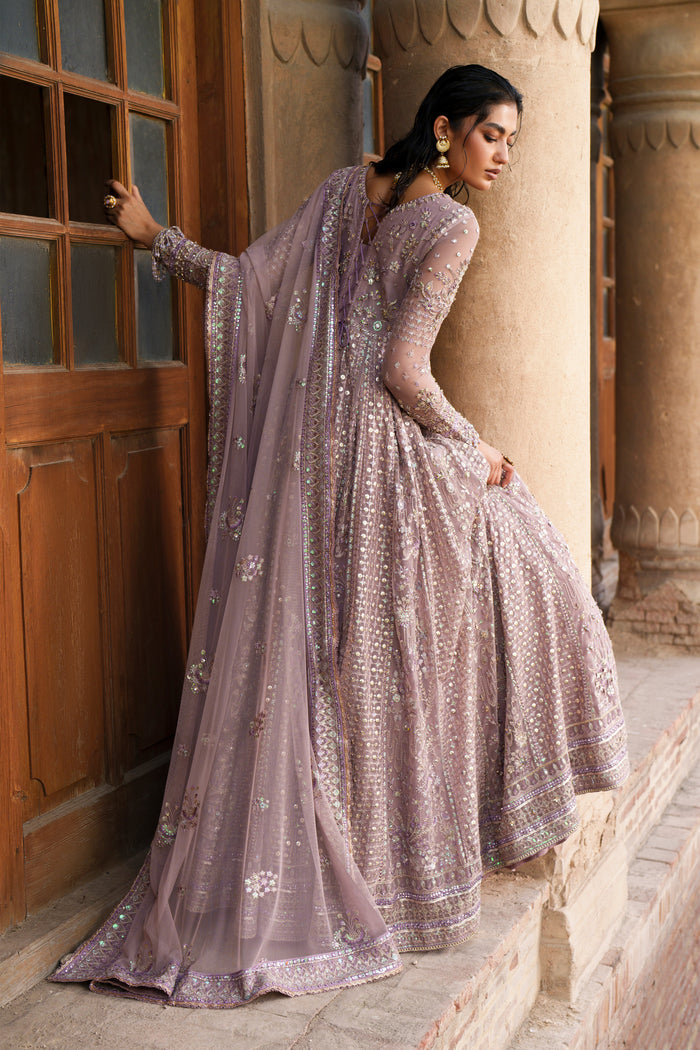 Blaithin tea pink Net maxi side view showing embroidered skirt panels and detailed hem border.