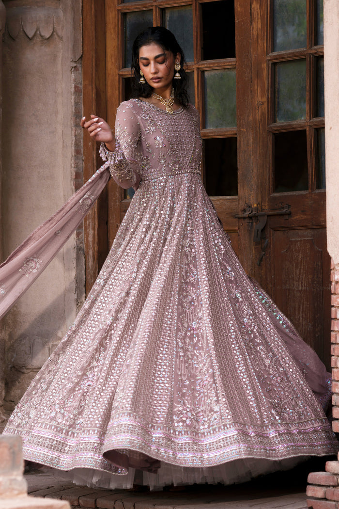 Blaithin tea pink formal maxi front pose with fitted bodice, boat neckline and flowing skirt.