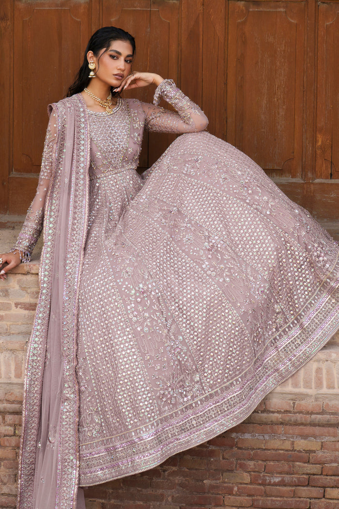 Blaithin tea pink evening outfit seated view with detailed Net dupatta and flowing maxi.