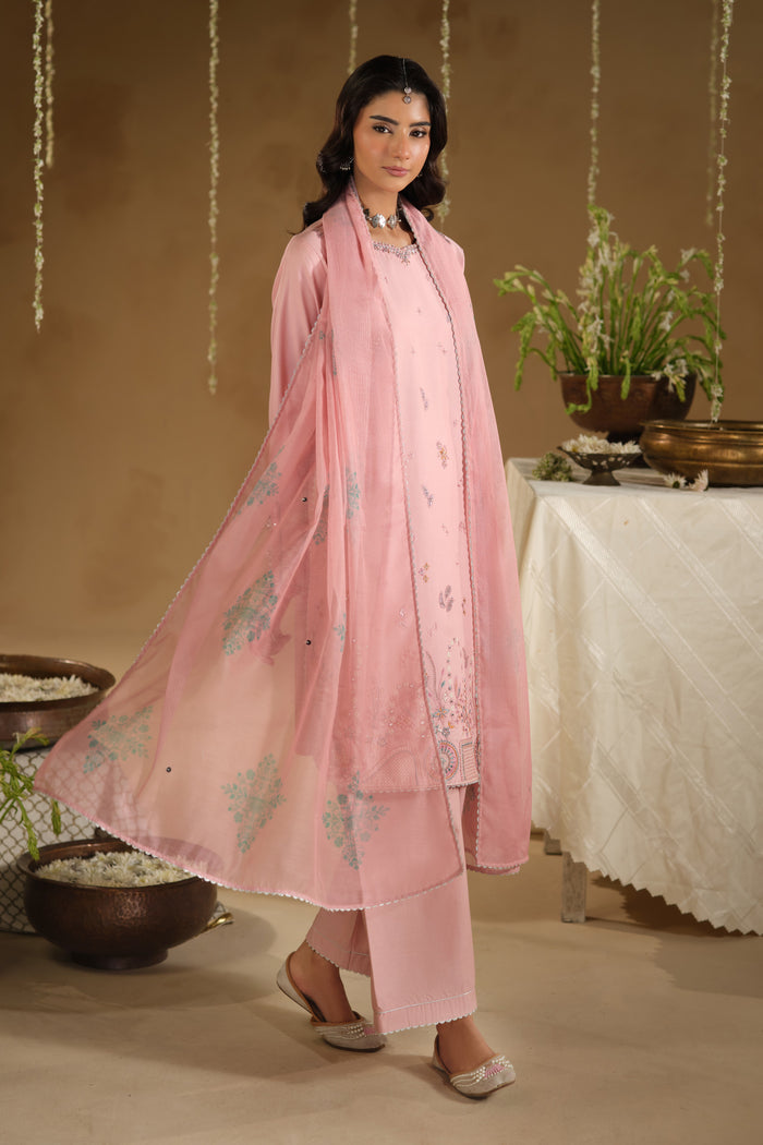 Side walking pose of Dana pink festive dress showing modest shirt silhouette and straight culotte trousers