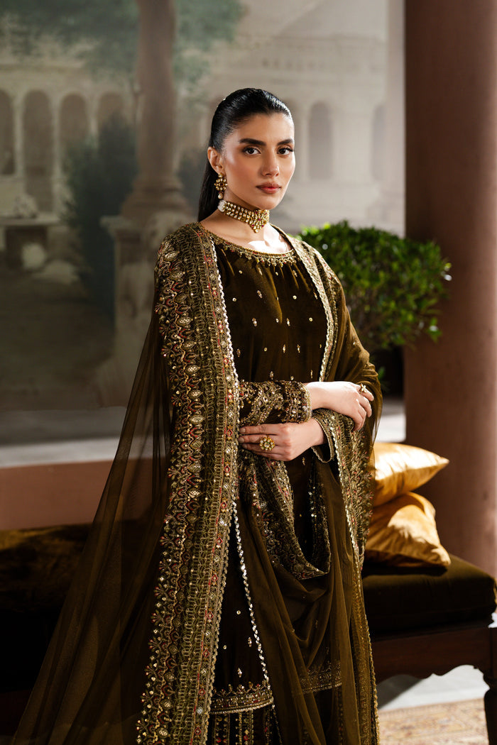 Slight angle shot of Danara 3-piece velvet sharara dress in mehndi green with embroidered shirt and flowing dupatta — NAQSHI premium design