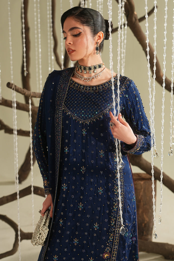 Close-up of royal blue formal shirt showing detailed adda work, embroidered neckline, and fine design on sleeves.