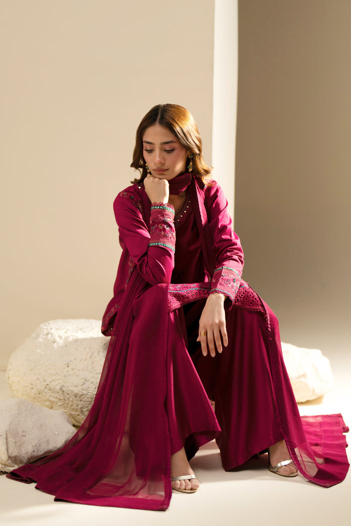 Easten Shocking Pink outfit styled seated with embroidered Cotton Sateen shirt and flowing Crinkle dupatta.