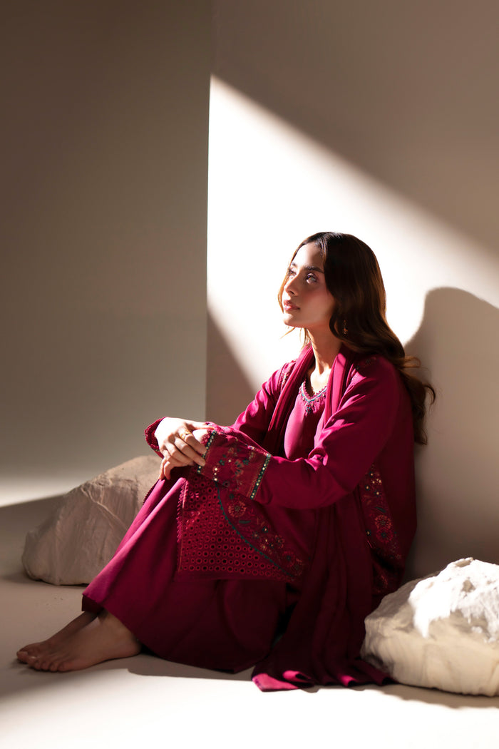 Easten Shocking Pink casual outfit seated in side profile with embroidered shirt and coordinated culotte.