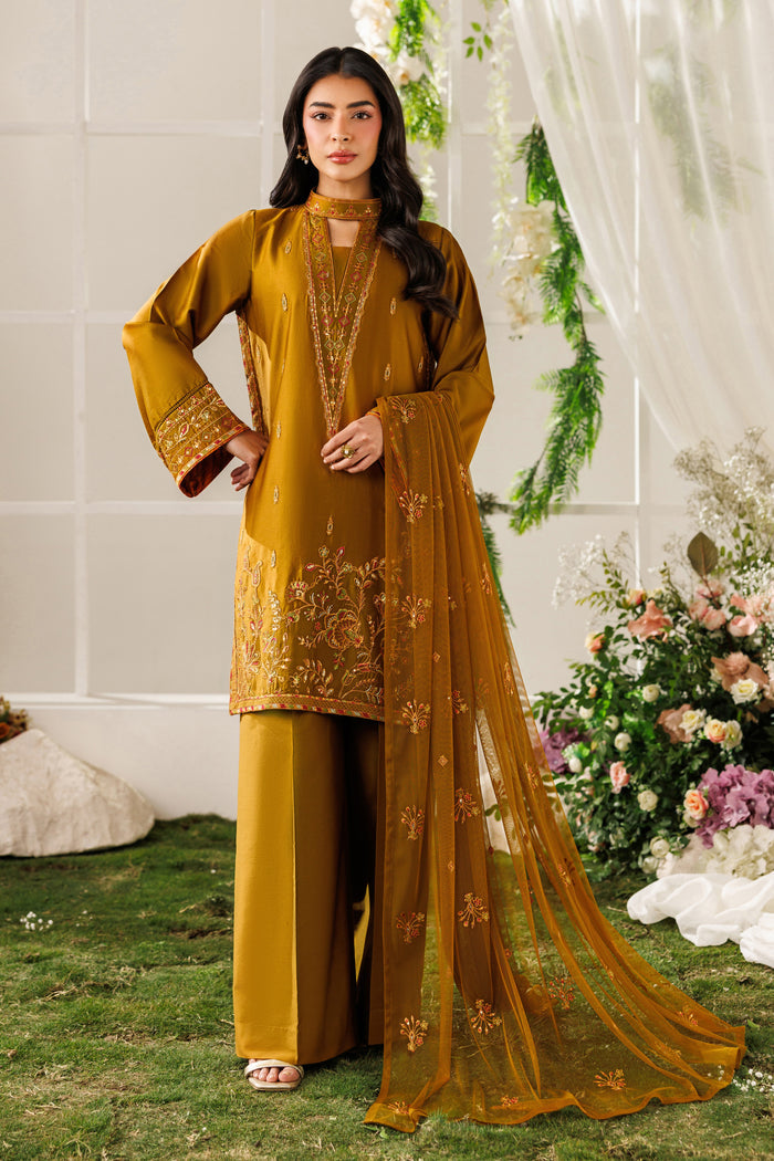 Front standing view of NAQSHI Eda outfit showing embroidered ban neck, golden brown tone, and balanced silhouette