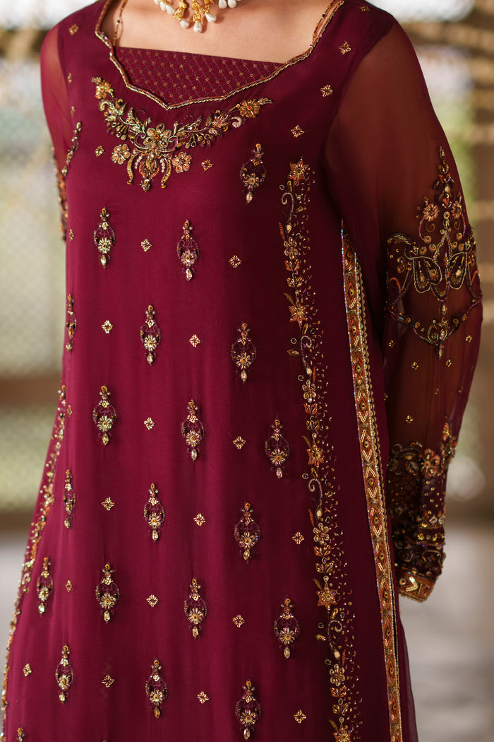 Close-up of Ehaad embellished neckline with tassel detail, sequins work and decorative adda embellishments on plum crinkle shirt