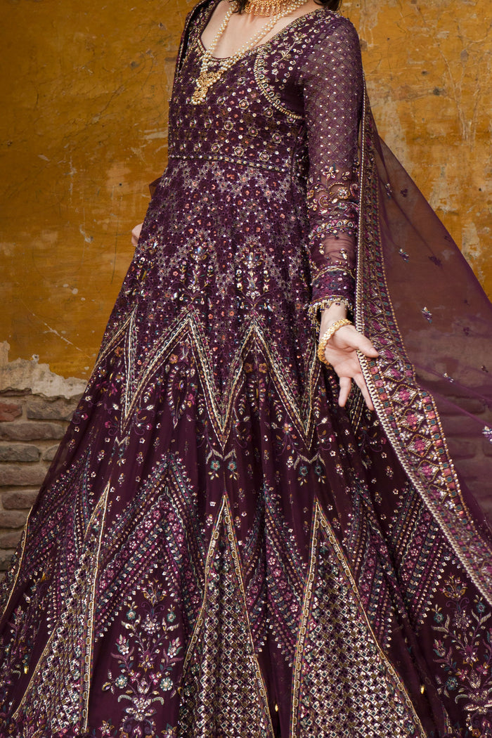 Emma plum Crinkle maxi side view highlighting flowing flare and detailed lower border.