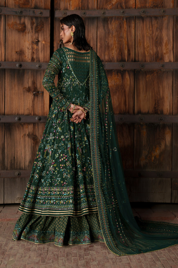 Etta deep green formal maxi full-length view showing fitted sleeves and richly detailed panels.