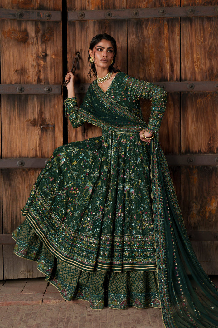 Etta deep green Crinkle maxi styled with embroidered Net dupatta and flowing layered flare.