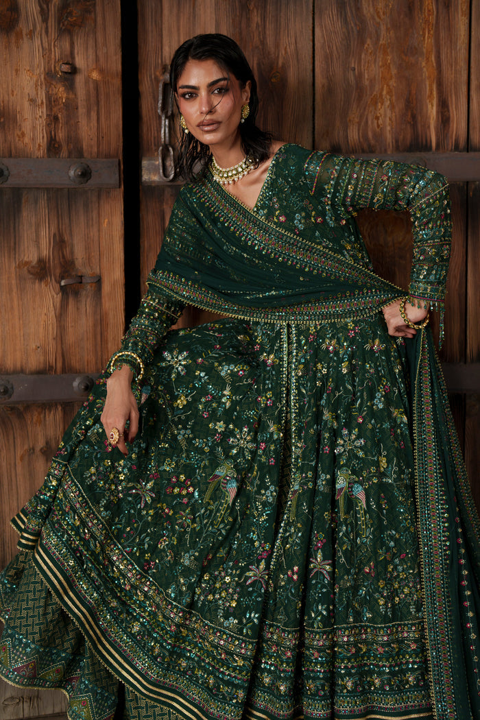 Etta deep green evening maxi portrait with V-shaped neckline, adda work and floral detailing.