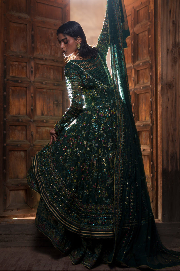 Etta deep green maxi back view showing fitted sleeves and embroidered flowing panels.