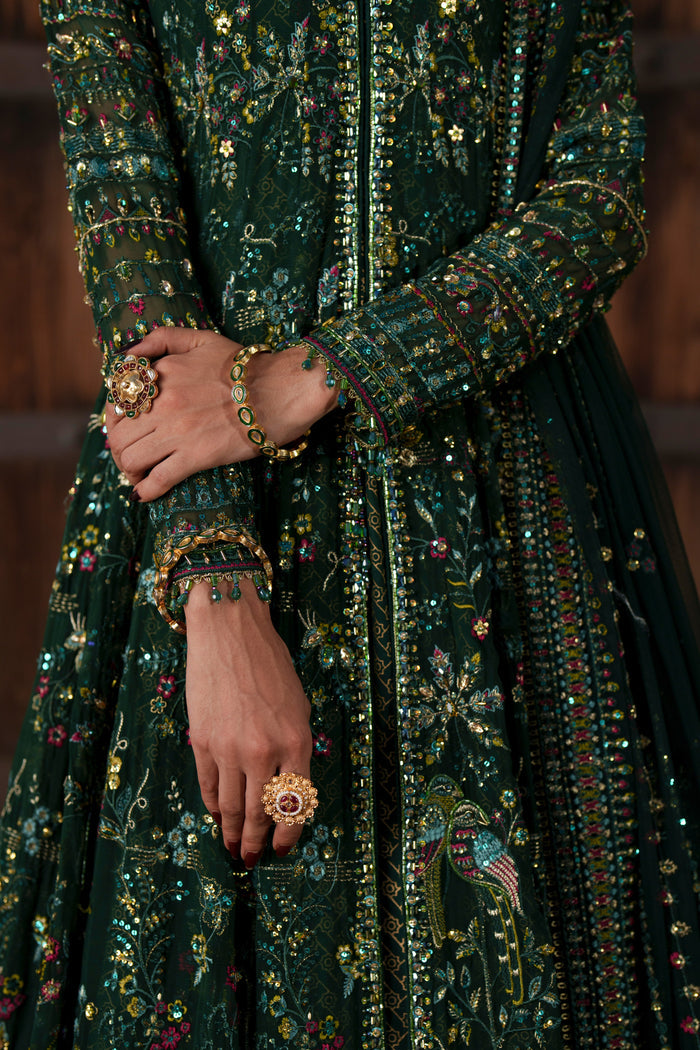Etta deep green formal maxi close-up showing embroidered sleeve and sequin detailing.