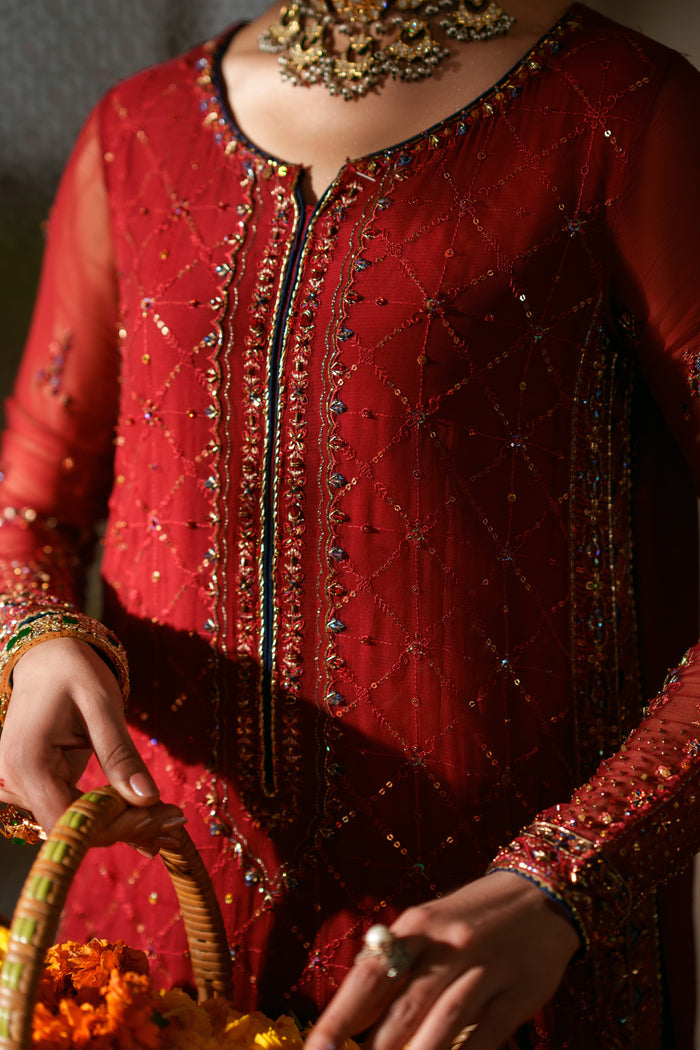 Faheel red crinkle semi formal outfit featuring dark blue embellished dupatta, culotte trousers and elegant festive wear styling