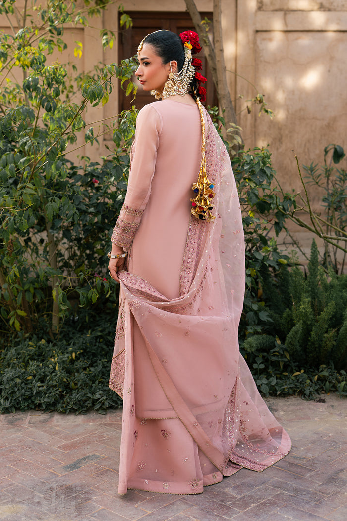Back view of Faris peach organza semi formal outfit with embroidered long shirt, flared trousers and organza brochia dupatta
