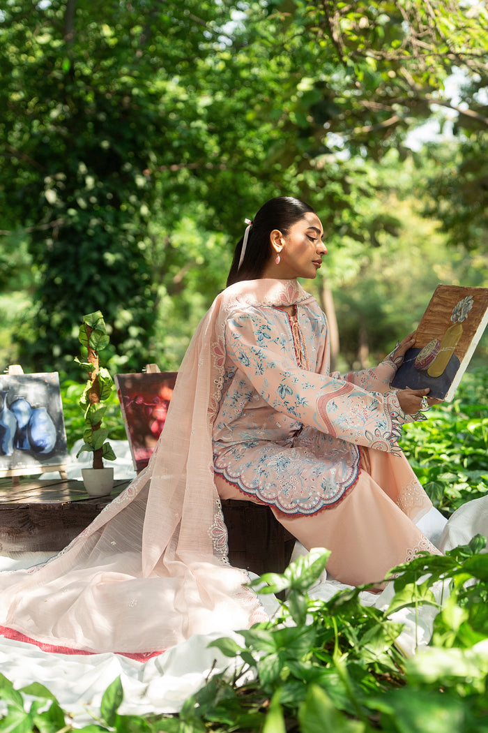 Sitting pose of Fizba pink summer outfit showing straight cambric trouser and comfortable breathable lawn fabric