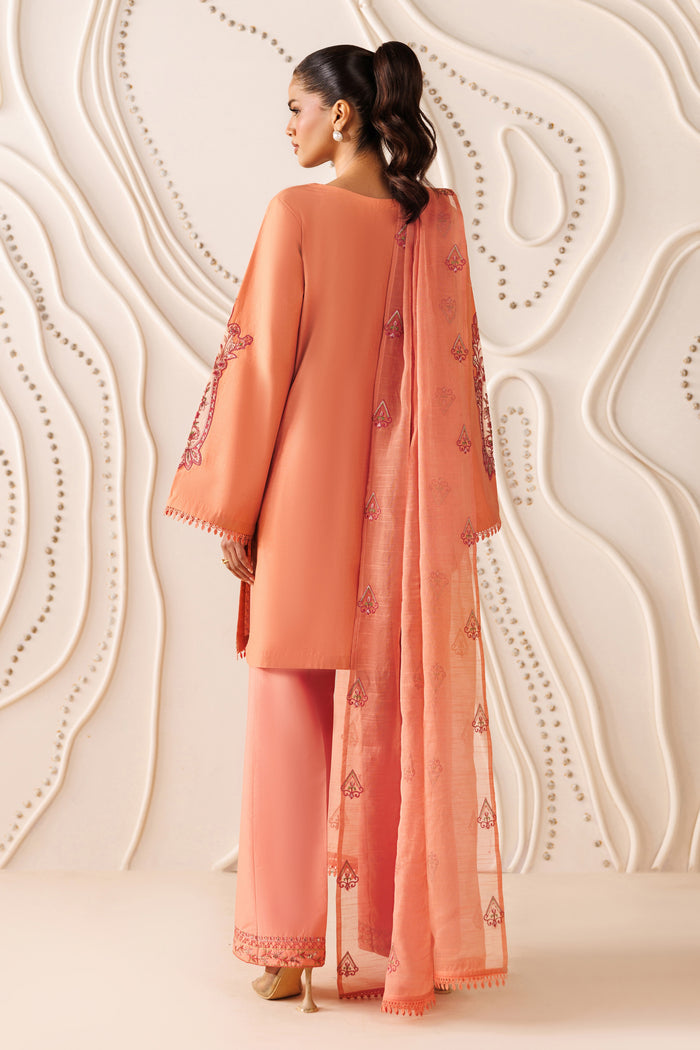 Back view of NAQSHI Flaira outfit showing cambric shirt fall, wide culotte trouser, and light cotton organza dupatta