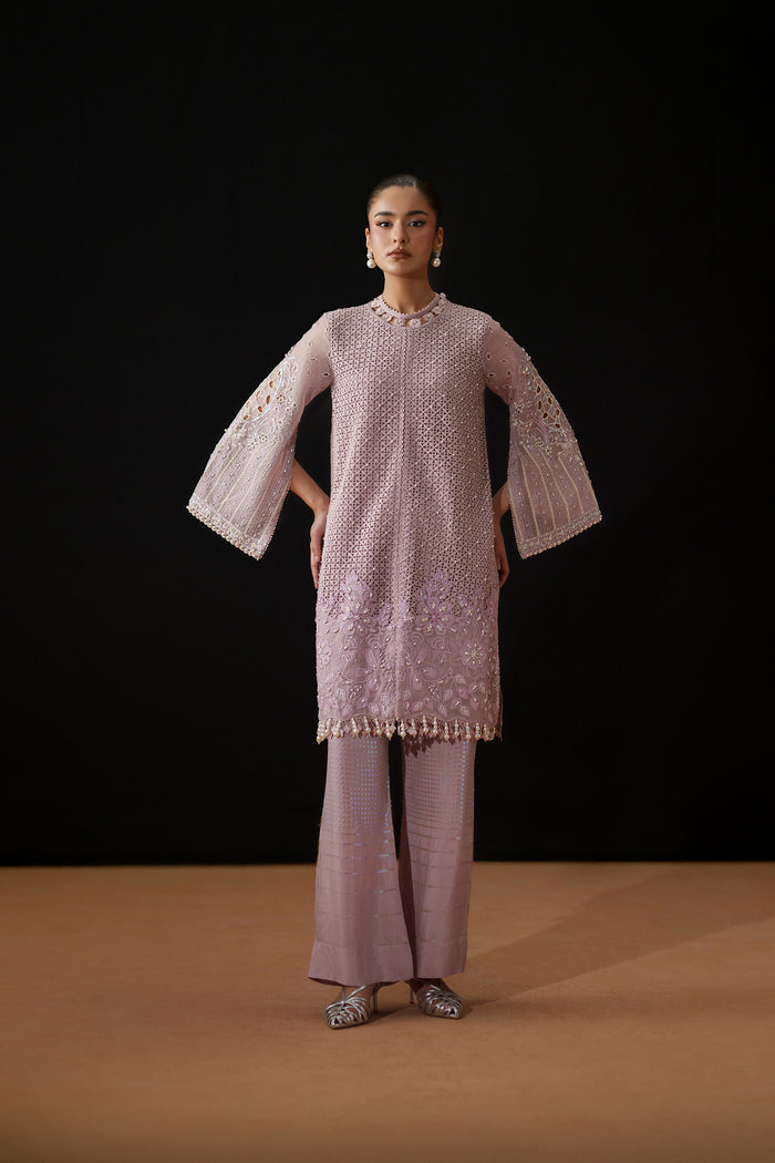 Full front view of Gigil showing the light purple Line Organza shirt, wide flowing sleeves and flared embroidered trousers.