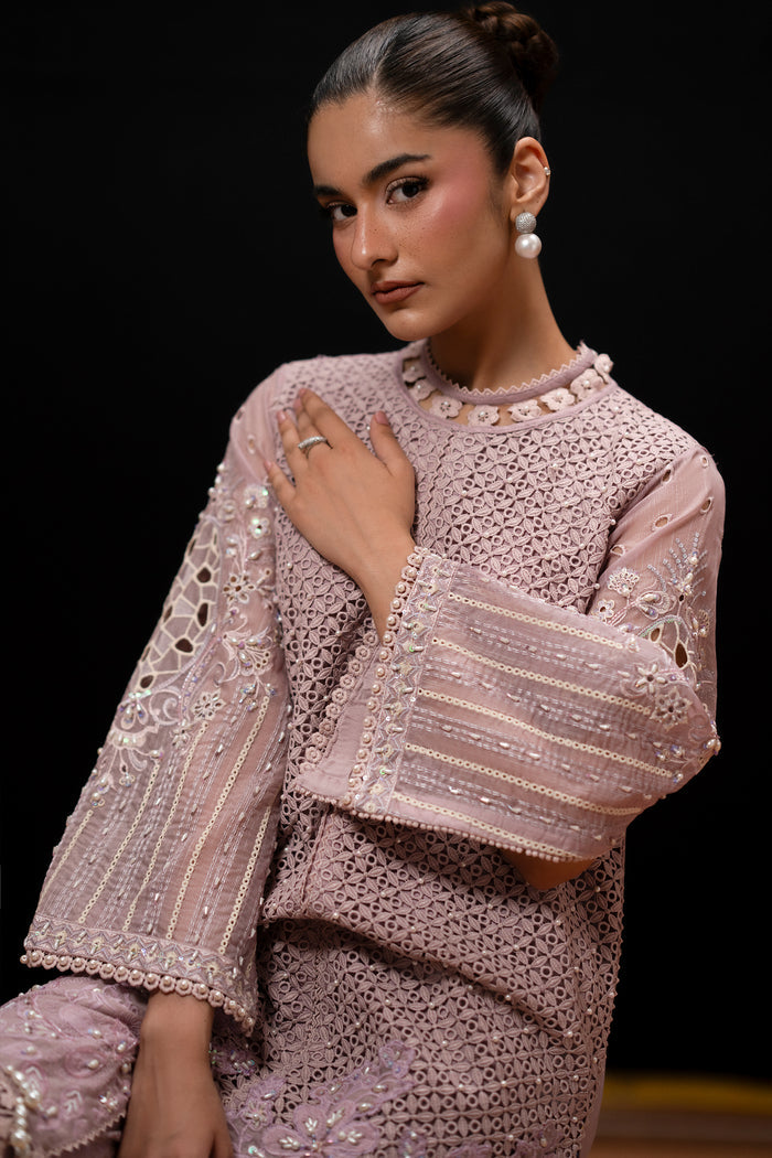 Close-up of Gigil showing the detailed neckline, embroidered Line Organza fabric and wide lace-finished sleeve.