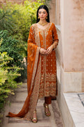 Rust Indian raw silk formal gown by NAQSHI with full embroidery, rounded neckline, long sleeves, wide embroidered hem, paired with matching trousers and chiffon dupatta.