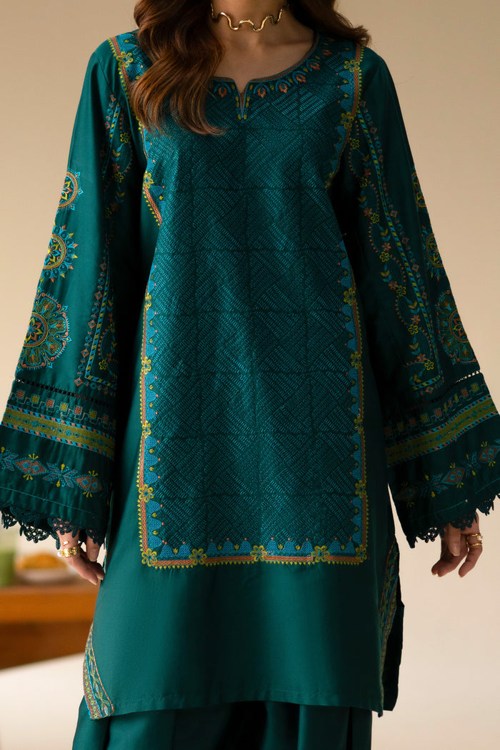 Close front view of Gunash Emerald Green shirt showing embroidered neckline, textured work and detailed sleeves.