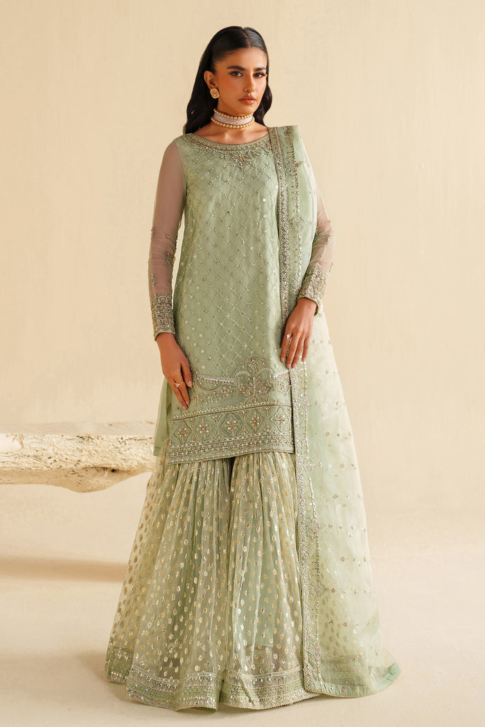 Full front view of NAQSHI sage green dress showing long flowy cut and elegant event styling