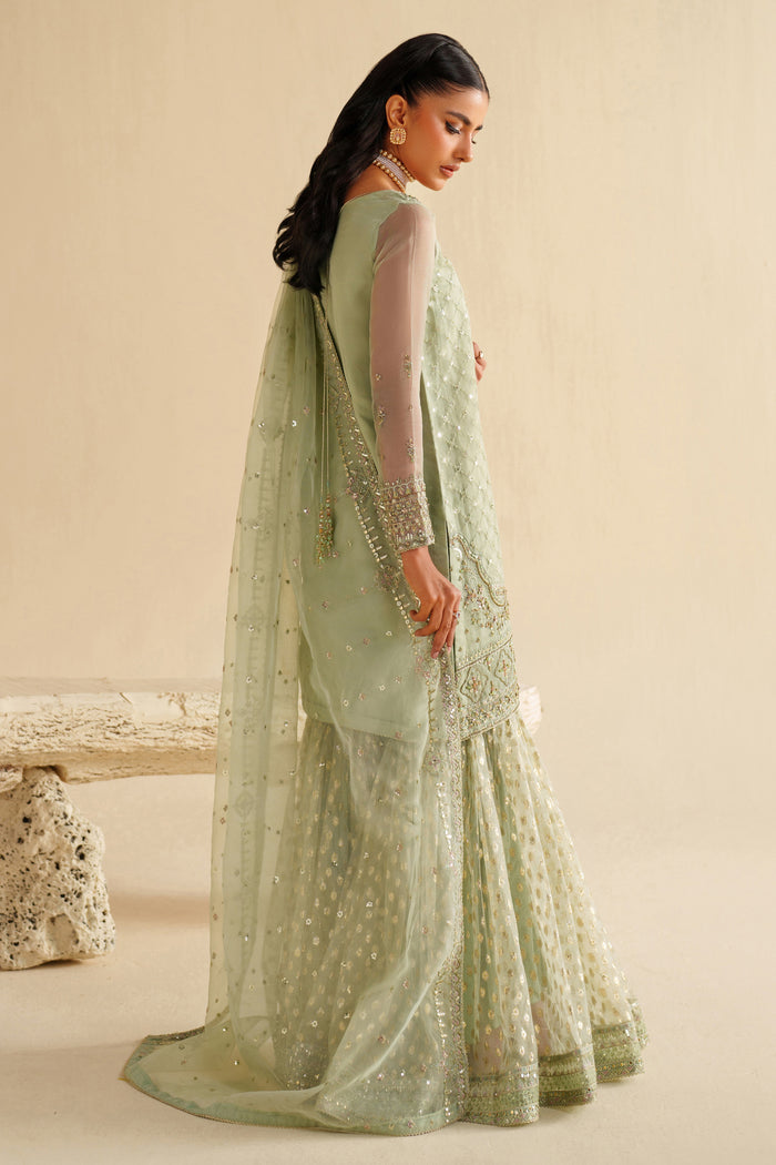 Back view of NAQSHI sage green dress highlighting dupatta fall and smooth, graceful look