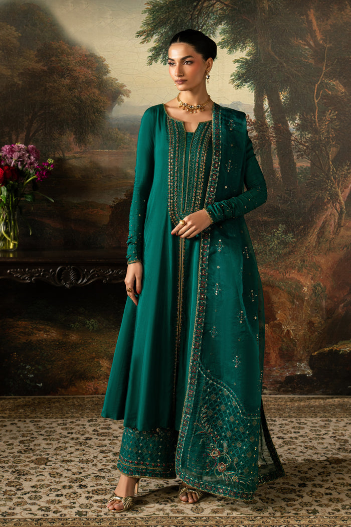 Haniya bottle green 3-piece semi-formal outfit with eight-panel Indian Raw Silk frock, PK Raw Silk culottes and embroidered Organza dupatta in a full front view.