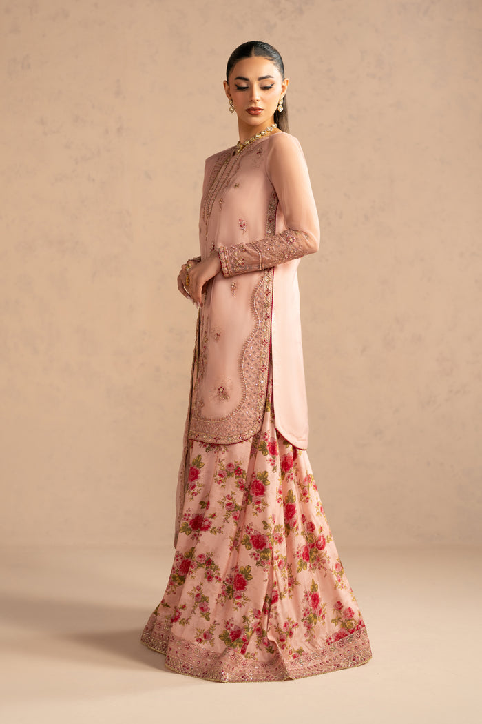 Side profile highlighting straight organza shirt silhouette and balanced length.
