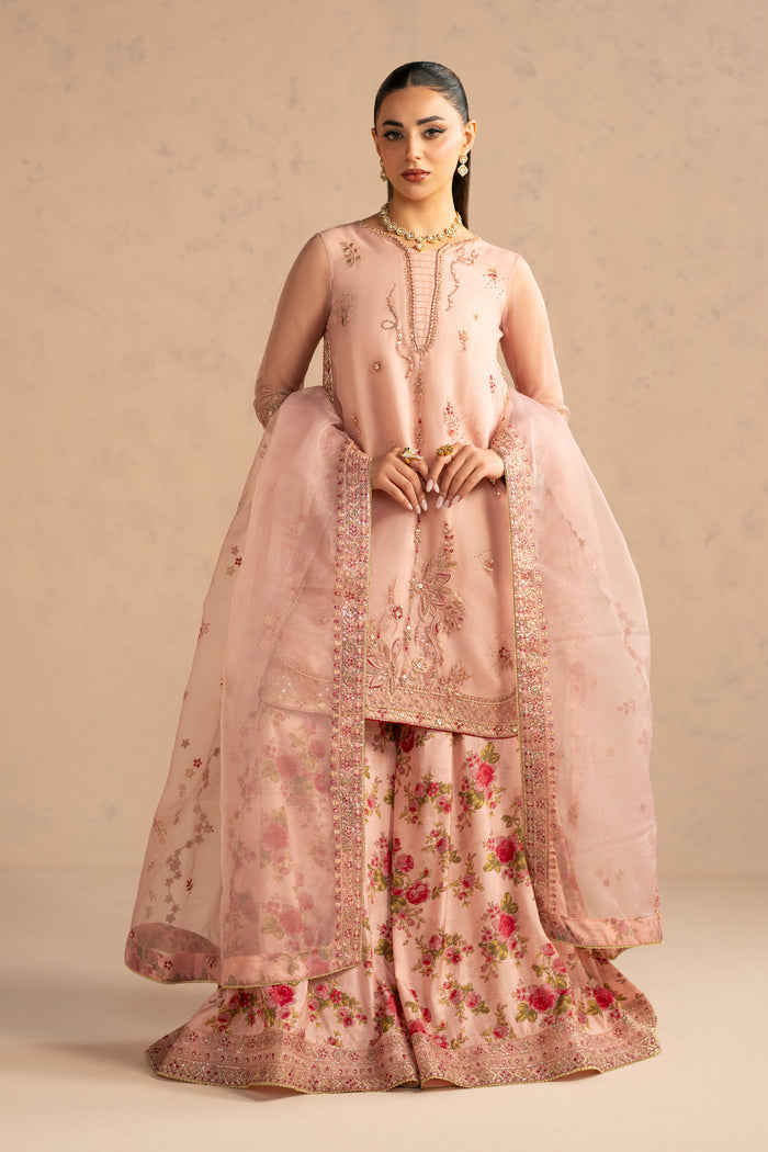 Front standing look displaying neat neckline detailing and coordinated sharara flare for wedding gatherings.