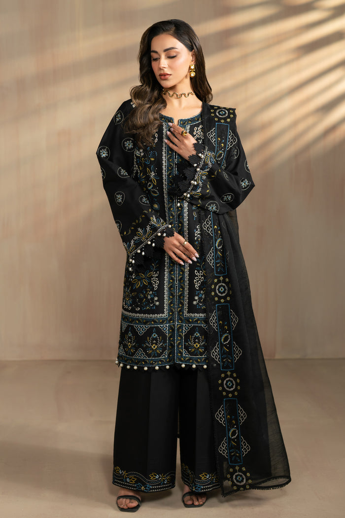 Hazeem black 3 piece embroidered lawn suit by NAQSHI, full front view with white thread embroidery long shirt, cambric culotte trousers and cotton organza dupatta, ready to wear summer formal outfit.