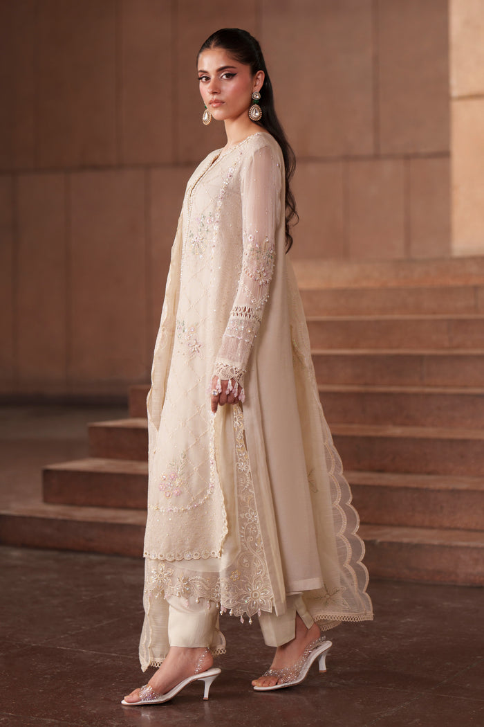 Side view of Ingrid off-white embroidered khadi net dress featuring long flowing silhouette, straight trousers and elegant cotton organza dupatta