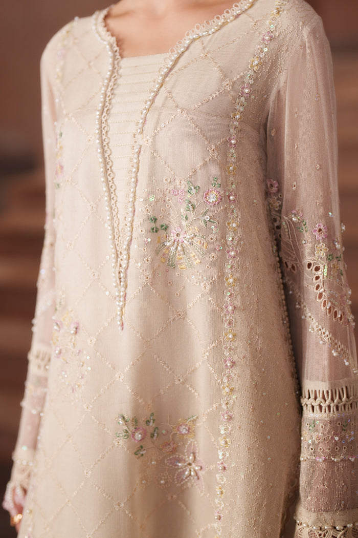 Close-up of Ingrid off-white embroidered khadi net shirt highlighting delicate sequin embroidery, panel detailing and refined neckline finish