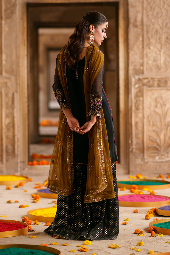 Three piece black and brown crinkle suit with detailed embellishment, flowing flary pants and net dupatta for evening events