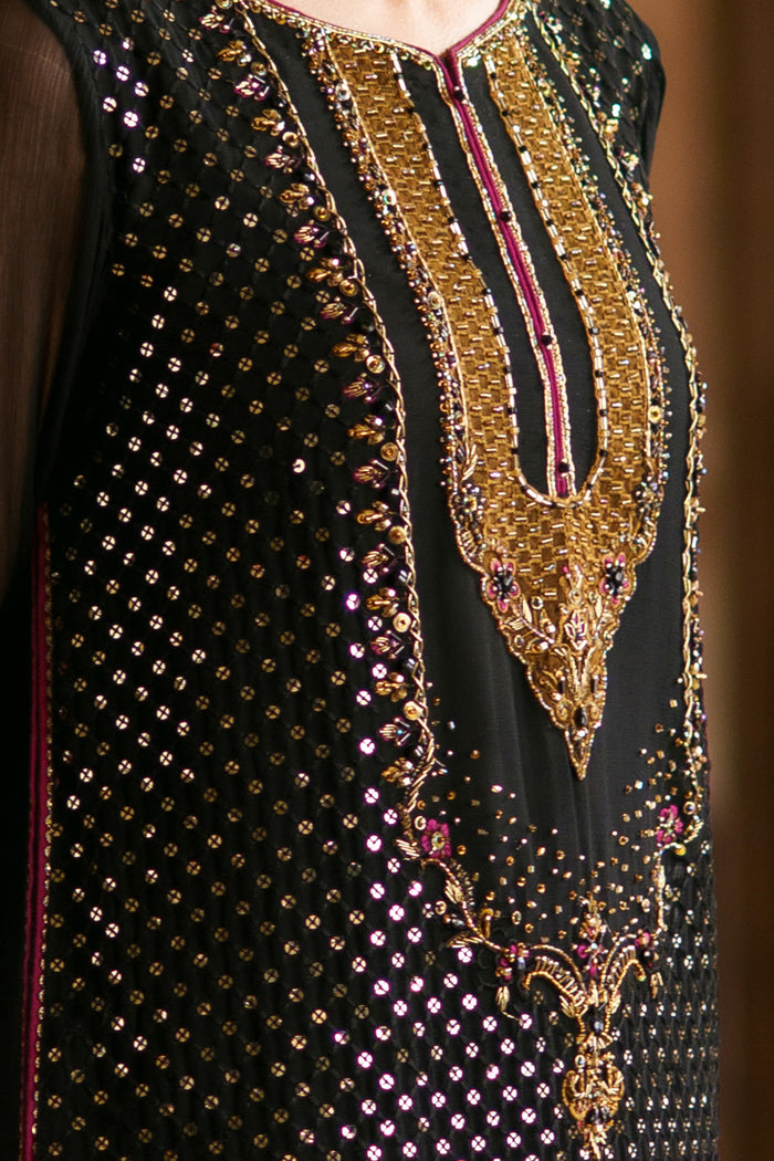 Close-up of embellished neckline with brown contrast applique detailing and sequins work on Irra black crinkle shirt