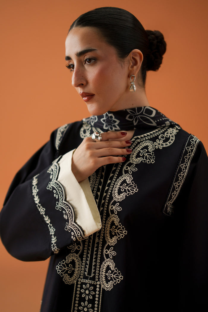 Close-up of Isla black embroidered neckline and sleeve details on a ready-to-wear lawn shirt for elegant festive styling.