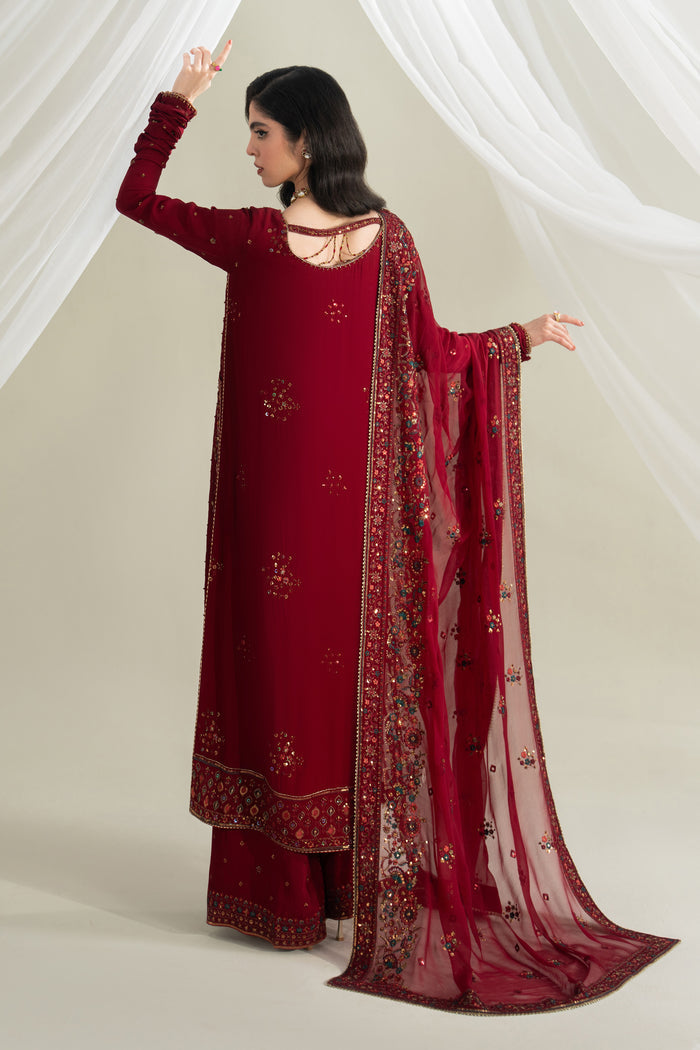 Deep red long flared shirt back view with culotte and crinkle dupatta, soft flowy formal outfit with tassel detail for special occasions