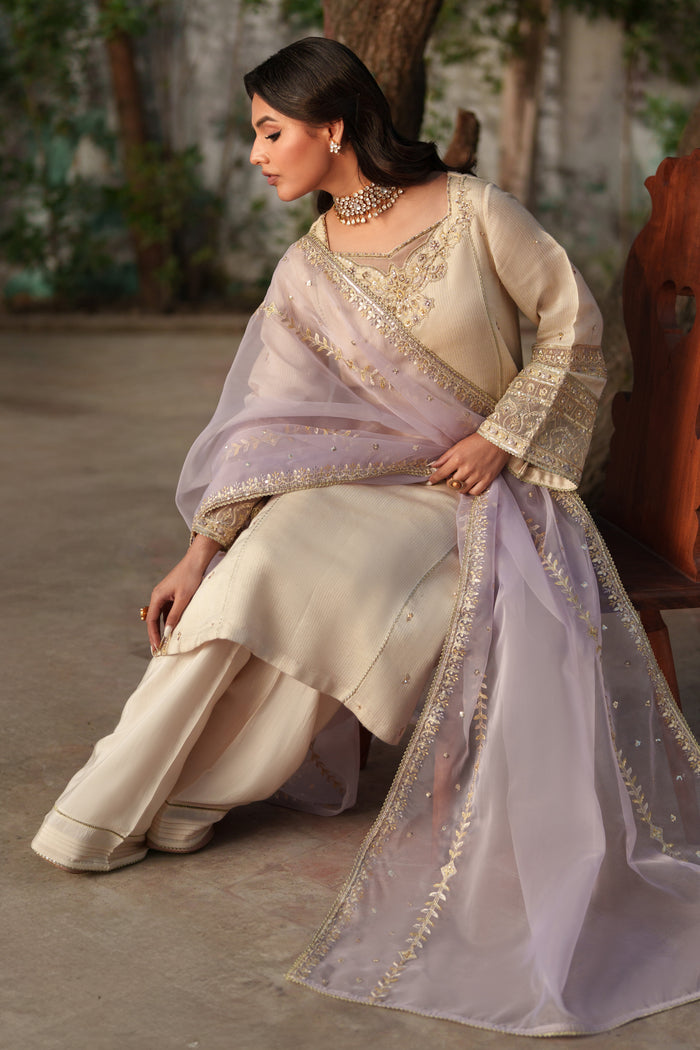 Model wearing NAQSHI Kai 3PC set: viscose shirt, silk culottes & embroidered lilac organza dupatta