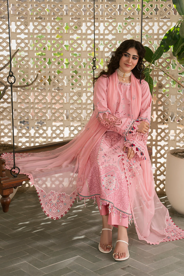 Walking pose of NAQSHI Kashmeera pink embroidered summer outfit highlighting flowing lawn shirt, wide-leg culottes and graceful movement