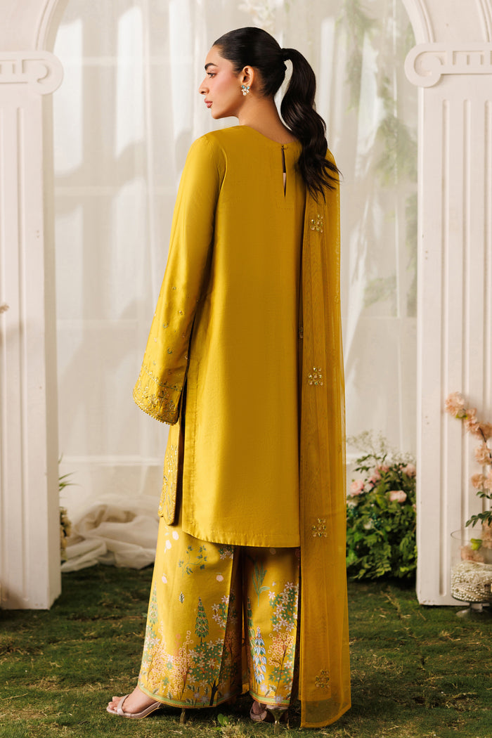 Back standing view of NAQSHI Kate outfit showing straight shirt fall, loose sleeves, and printed culotte trousers